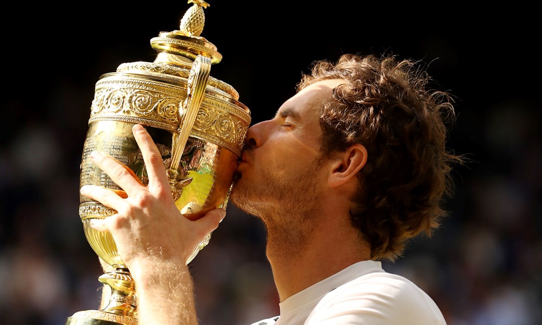 Andy Murray kisses the trophy after being crowned Wimbledon champion for the second time in his career