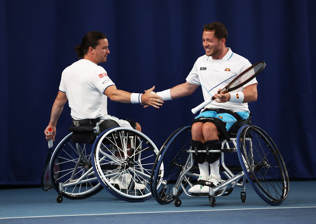 Alfie Hewett and Gordon Reid  high five after winning a point