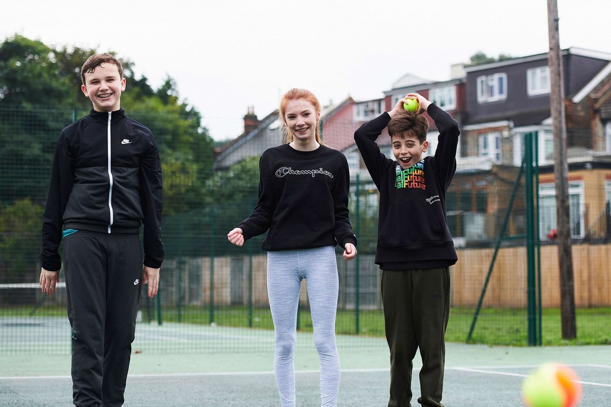 Children smiling on tennis court.jpg