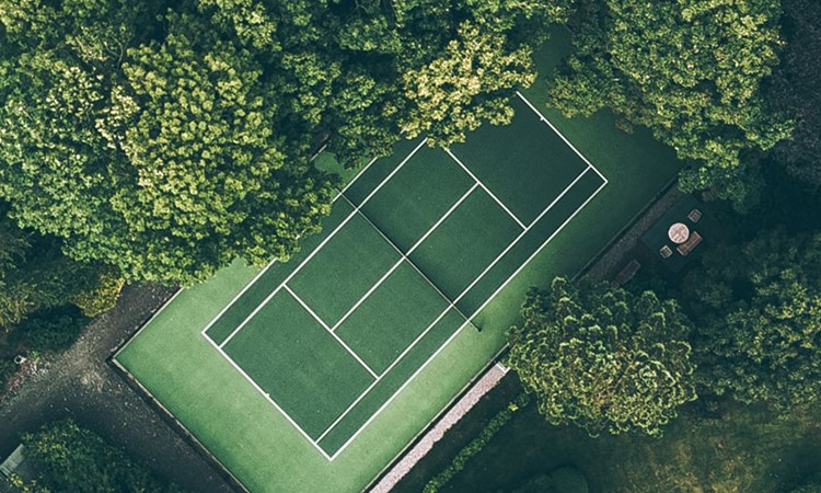 Tennis court situated amongst the trees