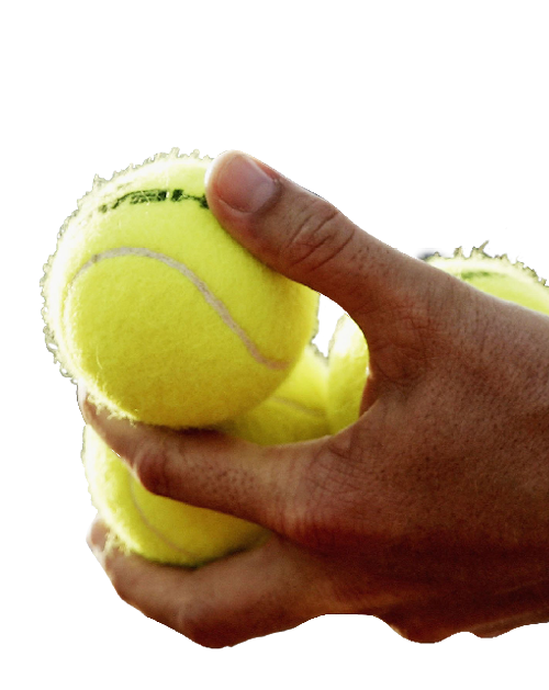 Cut out of tennis balls being held by a person